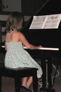 Best Music Lessons Near Me – Best Piano Lessons – Girl at Grand Piano