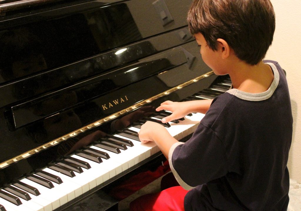Ways Around the Difficulty of Playing the Piano Due to Short Fingers and Small Hands - Boy Playing Piano - What’s the Best Lesson You’ve Had with Your Music Teacher - How Do Musicians Find Enough Time to Practice Their Instruments - Is the Suzuki Music Methodology Bad for Learning Piano