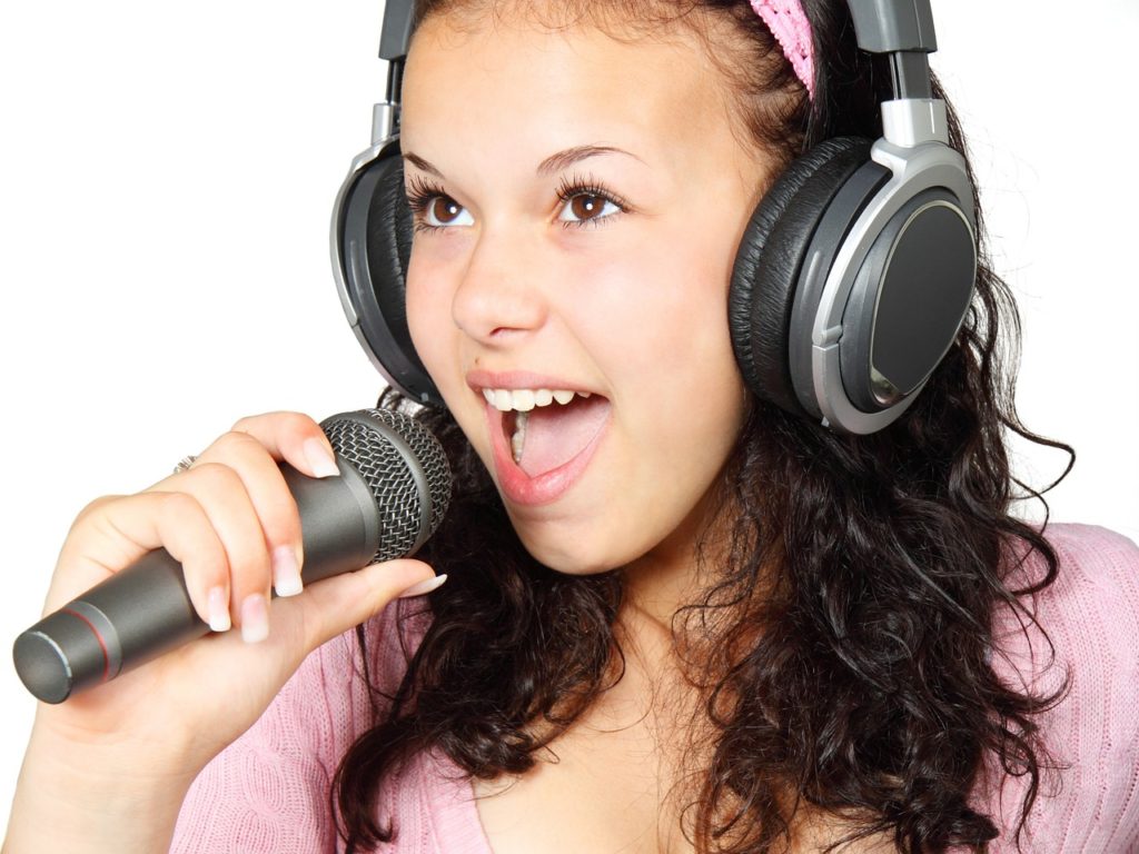 singing exercises with harmony - girl with mic - Singing in Tune with Vowels