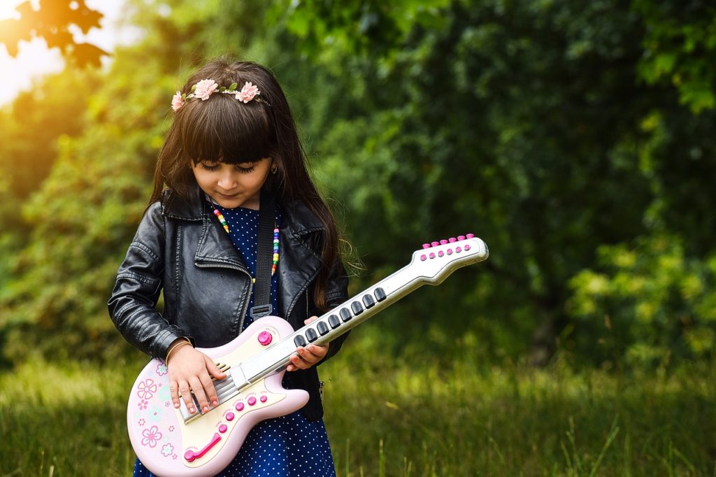 Success Music Studio - Girl Playing Toy Guitar