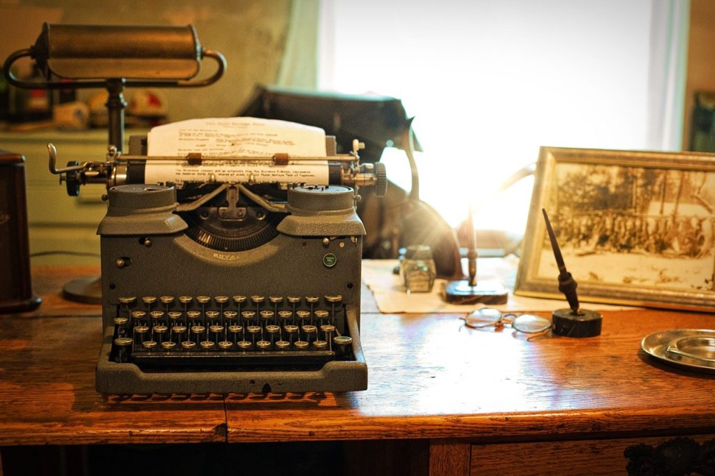 How to Extract a Melody from Your Lyrics - vintage-typewriter-on-desk - The Narrator’s Point of View in Your Songwriting.jpg