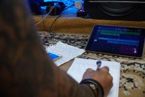 Where Do I Get Inspiration for My Lyrics - Songwriter with Notepad and Tablet