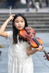 Do People with ADHD Have Difficulty Playing from Sheet Music - Girl with Violin