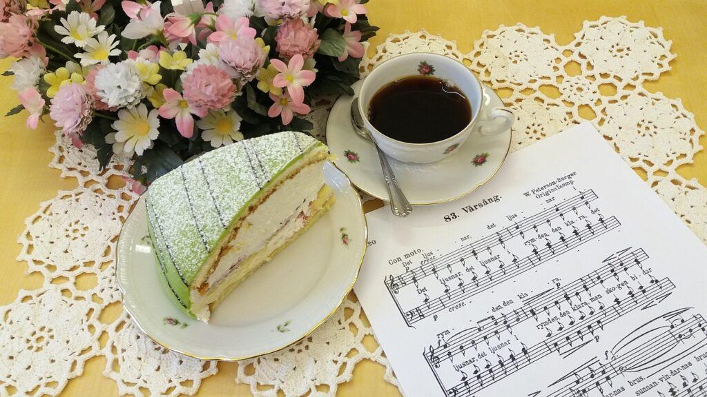 Why is it Important to Define the Dynamics to Sing a Piece of Music - sheet music, cake, and coffee