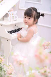Is the Suzuki Music Methodology Bad for Learning Piano - Little Girl at Toy Piano