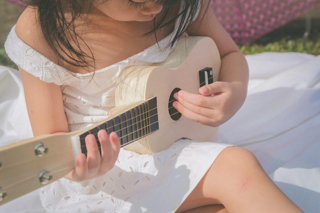 Musical Talent and Giftedness - Kid Playing a Ukulele