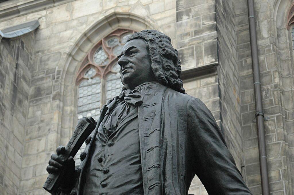 Explore Bach’s Hypnotic Choral Music in Less Than Four Minutes - Bach Statue - Explore Bach’s Epic Orchestral Music in Less Than Four Minutes