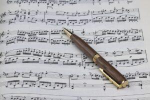 How to Unlock Music Key Changes with Modulation - Sheet Music and a Pen