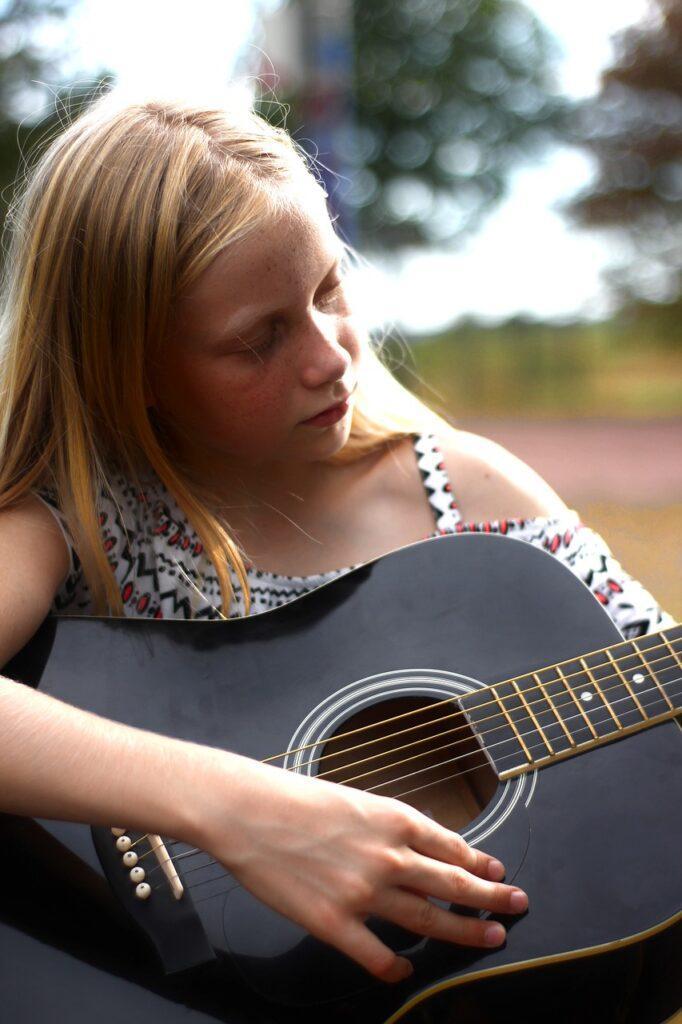 How to Teach Music to Neurodivergent Students - Girl with Guitar