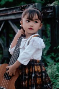 What’re Critical Fine Motor Skills for Special Needs Music - Girl with Ukulele