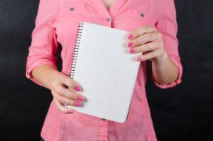 What Is an Oxymoron and How to Write It - Notebook and Pink Shirt