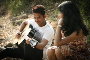 How to Write Powerful Love Song Lyrics - Romantic Couple with Guitar