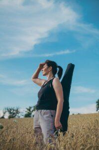 How to Choose the Best Guitar Case for You - Woman with Gig Bag