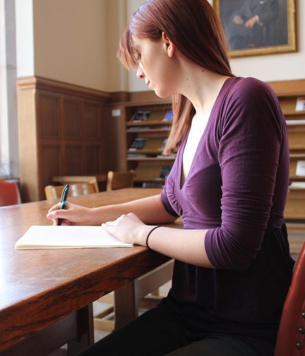 How Do I Write Good Songs Using Metaphors and Similes - Woman Writing Lyrics at a Table - 17 Songwriting Ideas to Get You Unstuck - Active Versus Passive Voice: How to Write Them