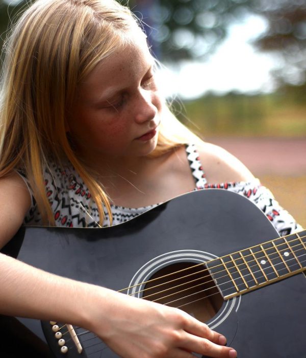 How to Teach Music to Neurodivergent Students - Girl with Guitar