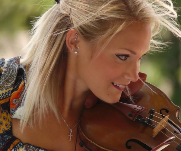 What Is Your Definition of a Good Musician - Woman Playing Violin