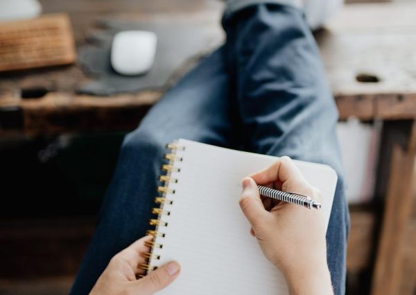 What Is an Adverb - Learn About Amazing, Adaptable Adverbs - Man Writing - What's Assonance and What’s the Best Way to Use it in Writing? - What Is Satire and How to Write It