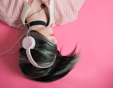 writing well crafted songs - girl in pink with headphone